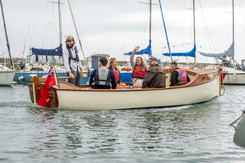 Boat Building Academy students launch their boats in Lyme Regis - photo © BBA