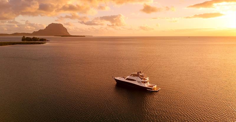 Riviera 72 Sports Motor Yacht Le Mercœur anchored  photo copyright Riviera Australia taken at  and featuring the Power boat class