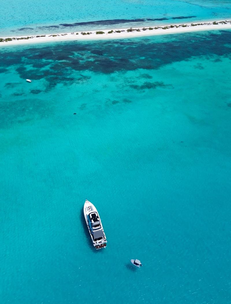 A thin strip of sand is home to a variety of sea birds photo copyright Riviera Australia taken at  and featuring the Power boat class