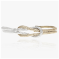 Reef knot bracelet in sterling silver and brass by Angela Lago