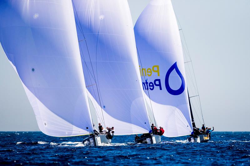 Fleet racing downwind at the RC44 World Championship Marina de Sotogrande photo copyright Pedro Martinez / Martinez Studio taken at Sotogrande Yacht Club and featuring the RC44 class