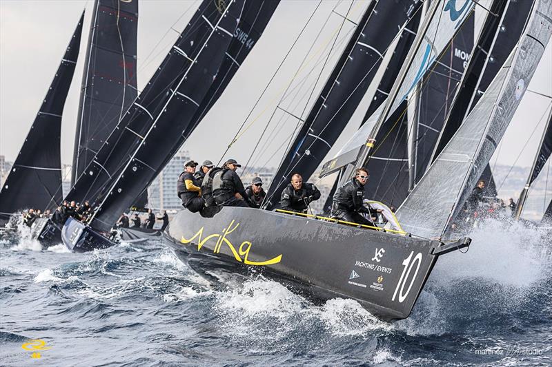 Team Nika round the windward mark in second place in race one on day 1 of the RC44 Valletta Cup fleet racing - photo © Nico Martinez / www.MartinezStudio.es
