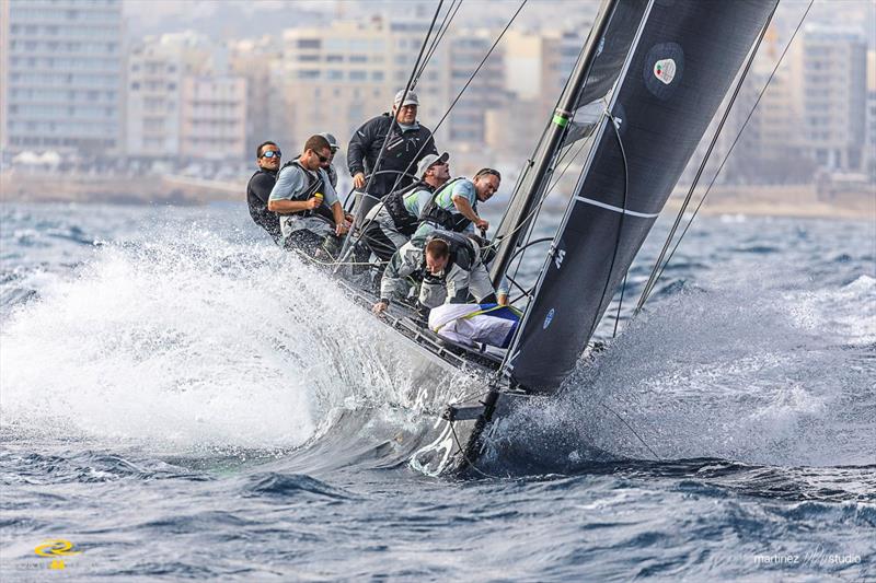 Team Aqua break through the waves on day 1 of the RC44 Valletta Cup fleet racing - photo © Nico Martinez / www.MartinezStudio.es