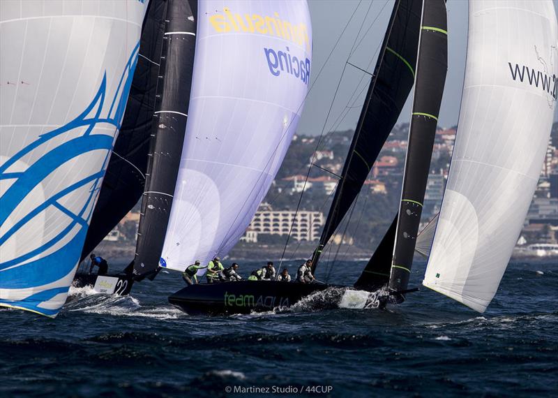 Team Aqua leads Peninsula Petroleum and Bronenosec Sailing Team down the run - 44Cup Cascais photo copyright Pedro Martinez / Martinez Studio taken at Porto Montenegro Yacht Club and featuring the RC44 class