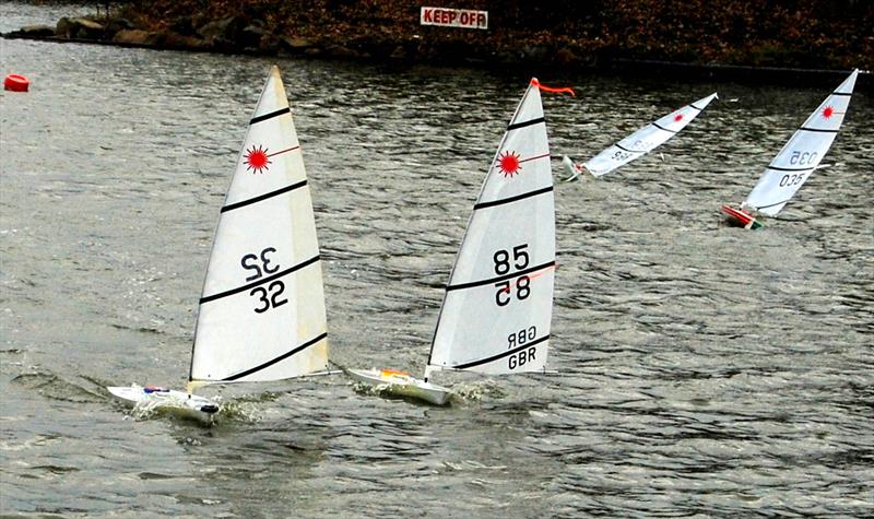 RC Lasers racing hard in the difficult conditions at Blackpool & Fylde MBC photo copyright Eric Craven taken at Blackpool & Fylde Model Boat Club and featuring the RC Laser class