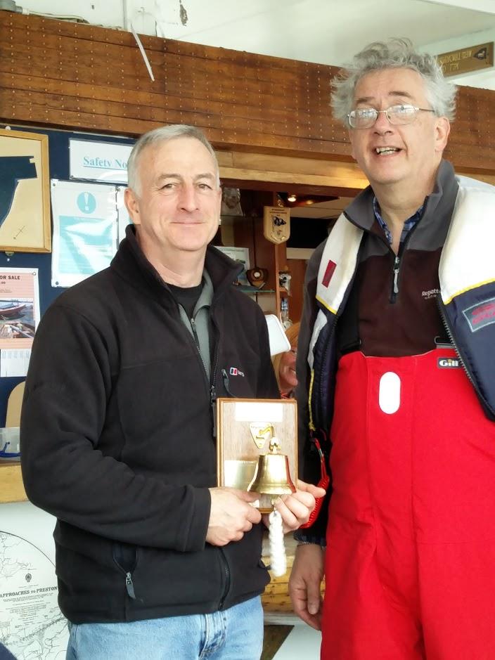 Alan Tickle presents the Bell Trophy to Winner RC Lasers Shaun Holbeche after the RC Laser and Df65 Winter Series finale photo copyright John Sharman taken at West Lancashire Yacht Club and featuring the RC Laser class