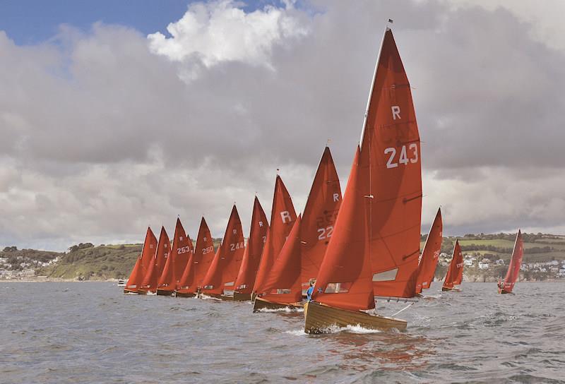 Looe's distinctive Redwing fleet - the class was specifically designed for Looe Bay by the legendary Uffa Fox in 1938 - races across the starting line at one of the twice weekly events held during the summer months photo copyright Neil Richardson taken at Looe Sailing Club and featuring the Redwing class