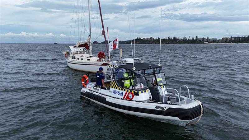 Volunteers from Marine Rescue Port Macquarie assist a sailor off the Hastings River bar photo copyright Marine Rescue NSW taken at  and featuring the RIB class