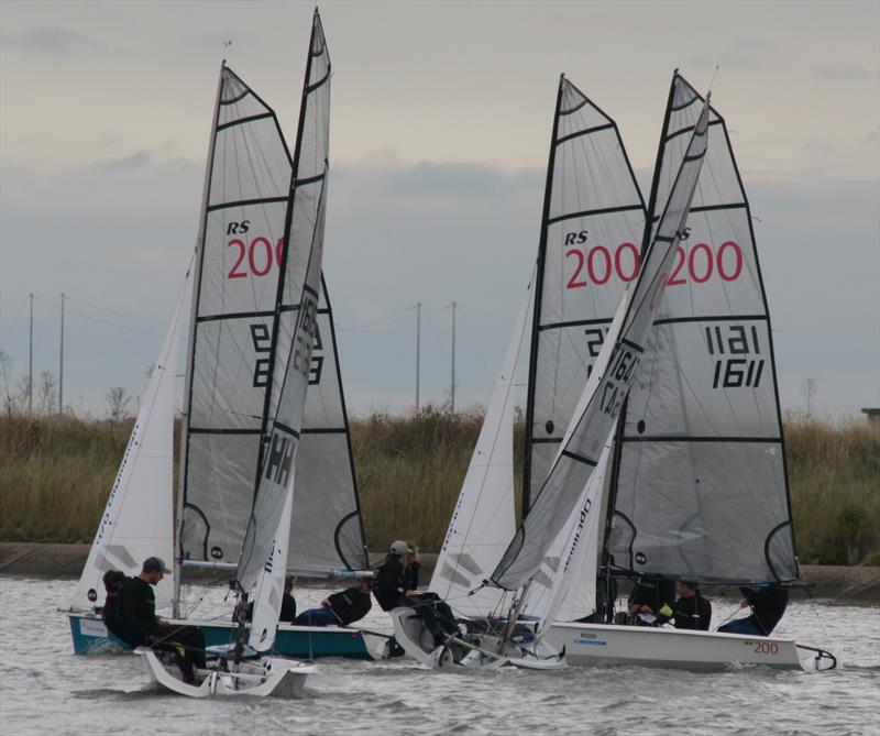 The moment Patience and Henderson took control of the race (blue hull) at the 60th Endeavour Trophy photo copyright Sue Pelling taken at Royal Corinthian Yacht Club, Burnham and featuring the RS200 class