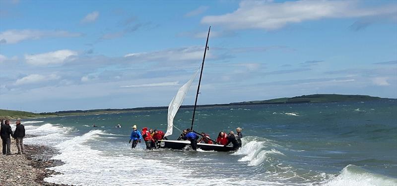 Fans help The Black Pearl up the beach during the RS400 Scottish Travellers event held at Largo Bay photo copyright Martin Booth taken at Largo Bay Sailing Club and featuring the RS400 class