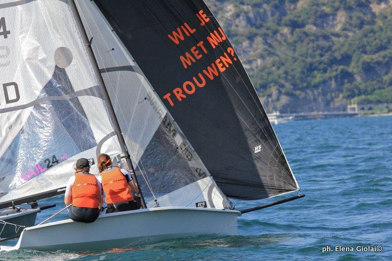 Michiel Geerling proposes to Hilde van Susante on day 1 of the RS500 Worlds at Lake Garda photo copyright Elena Giolai taken at Fraglia Vela Riva and featuring the RS500 class