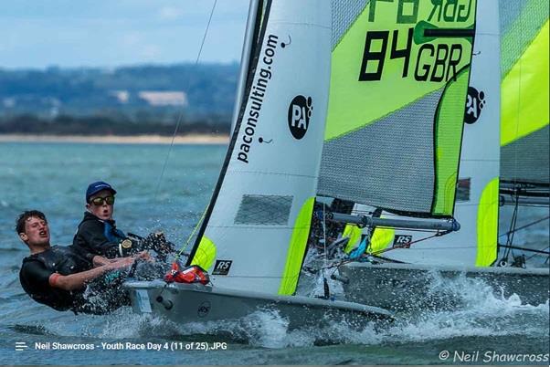 29er crew Cam Mitchell hops in to sail with Feva helm Tom Ahlheid for Thrashing Thursday's Fun Race at HISC Youth Open Race Week 2019 photo copyright Neil Shawcross taken at Hayling Island Sailing Club and featuring the RS Feva class