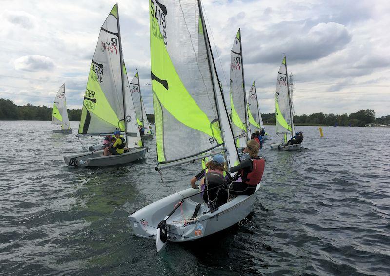 Start line action from the RS Feva open meeting at Burghfield photo copyright David Baddeley taken at Burghfield Sailing Club and featuring the RS Feva class