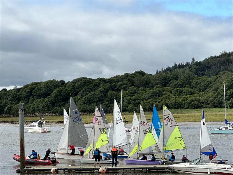 Kippford Week 2023 - Crews leaving the pier for racing out in the bay photo copyright Anne-Marie Williams taken at Solway Yacht Club and featuring the RS Feva class