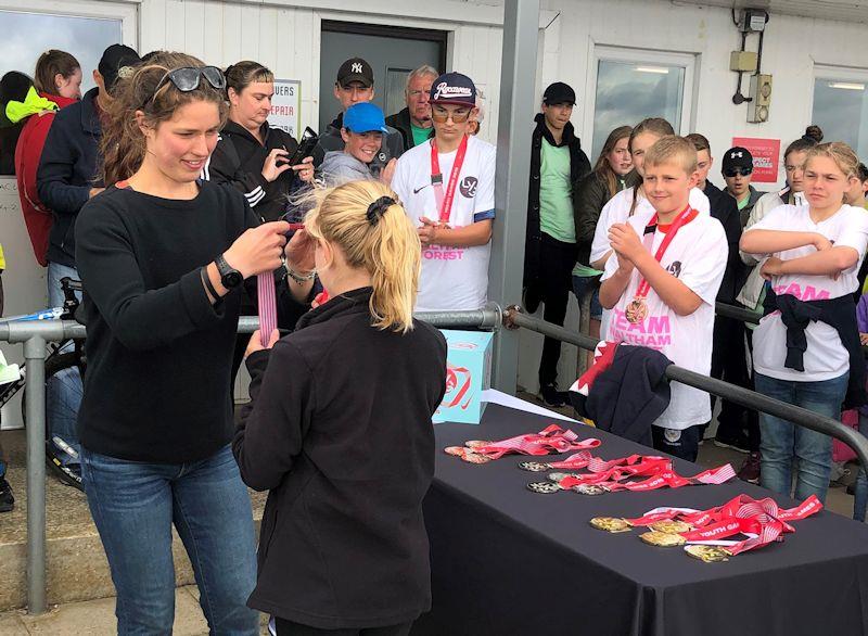 Iona Dixon presents prizes at the London Youth Games photo copyright RYA taken at Queen Mary Sailing Club and featuring the  class