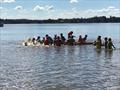 Sabot kids having lots of fun on the floating foam lily pad while waiting for the breeze to come in during the 58th Sabot National Championship © Rohan Nosworthy