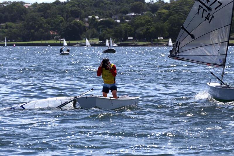 Sabot sailing is serious fun – most of the time…. Lucky he's tough, resilience training for Leo Pirret (7052, Easy Tiger, Race 5, coming 4th when he dropped his rig) photo copyright Sam Gong taken at Lane Cove 12ft Sailing Skiff Club and featuring the Sabot class