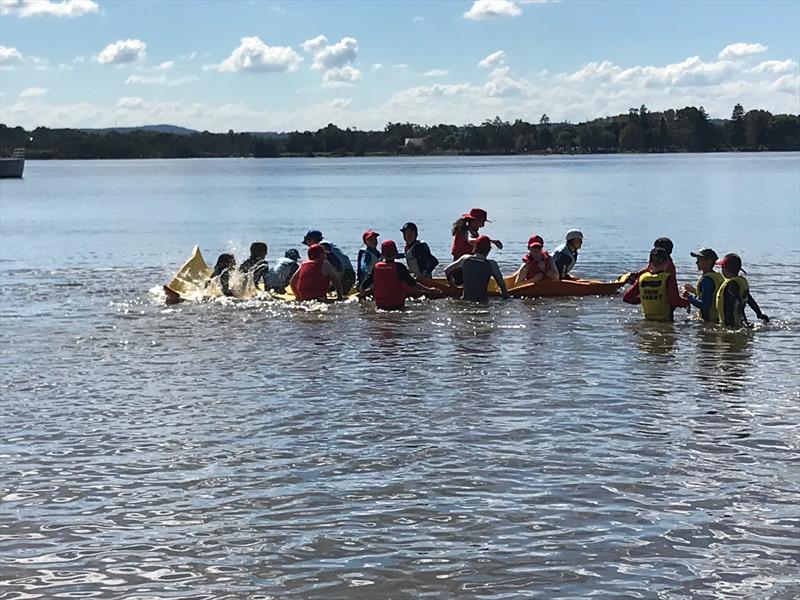 Sabot kids having lots of fun on the floating foam lily pad while waiting for the breeze to come in during the 58th Sabot National Championship - photo © Rohan Nosworthy