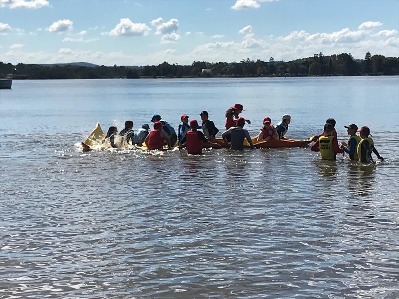 Sabot kids having lots of fun on the floating foam lily pad while waiting for the breeze to come in during the 58th Sabot National Championship - photo © Rohan Nosworthy