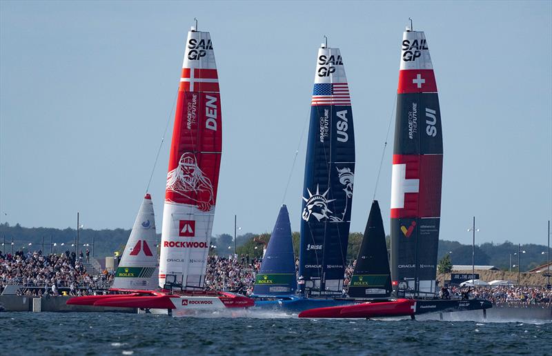 Denmark SailGP Team presented by ROCKWOOL, USA SailGP Team helmed by Jimmy Spithill and Switzerland SailGP Team helmed by Nathan Outteridge sail past spectators at the Race Village on Race Day 2 of the ROCKWOOL Denmark Sail Grand Prix photo copyright Bob Martin for SailGP taken at  and featuring the  class