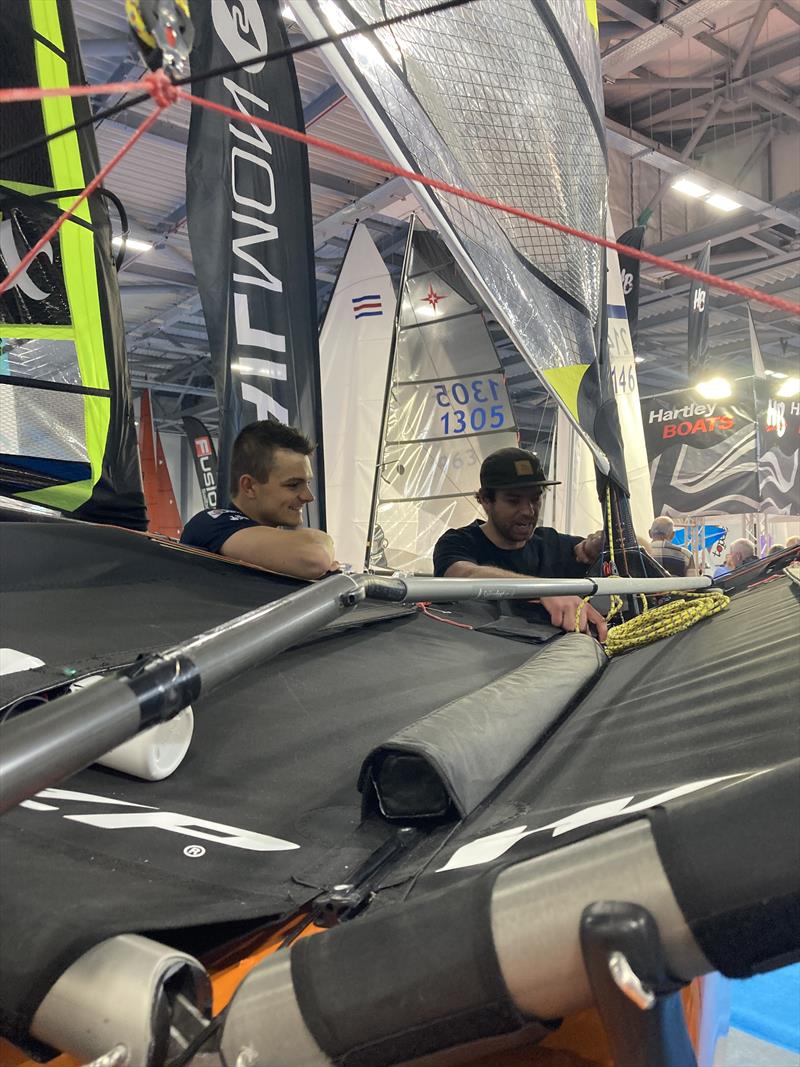 Sam Whaley and Martin Evans inspecting the WASZP at the RYA Dinghy & Watersports Show 2022 photo copyright Sailingfast taken at RYA Dinghy Show and featuring the  class