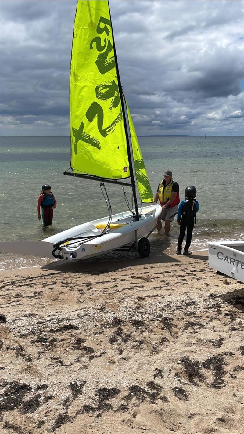 When the Optimist training is over in the Carter it's time for some fun with dad in the Zest. Smiles all round! - photo © Sailing Raceboats