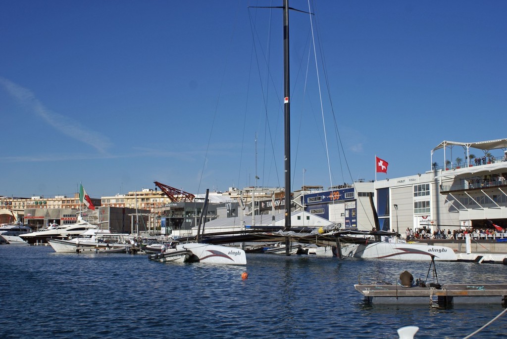 Alinghi awaits the PRO’s decision on Race Day 2, moored outside her base in the inner Darcena - photo © Richard Gladwell www.photosport.co.nz