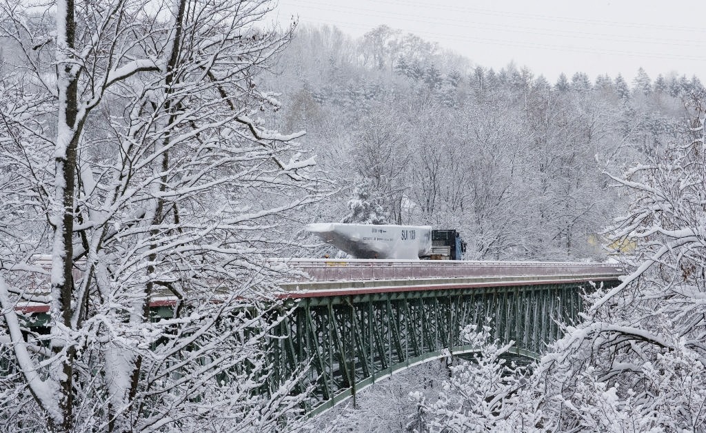 Alinghi SUI-100 leaves snowy Switzerland  en route to Valencia - photo © Ivo Rovira /Alinghi