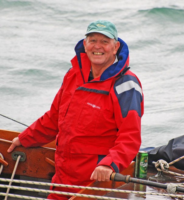 In his element - Bob Fisher, a smile on his face, a tiller in his hand and a cold beer waiting at his side. © SW