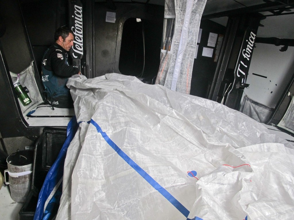 Jordi Calafat, fixing sails, onboard Team Telefonica during leg 8 of the Volvo Ocean Race 2011-12, from Lisbon, Portugal to Lorient, France. (Credit: Diego Fructuoso/Team Telefonica/Volvo Ocean Race) photo copyright Diego Fructuoso /Team Telefónica/Volvo Ocean Race http://www.volvooceanrace.com taken at  and featuring the  class