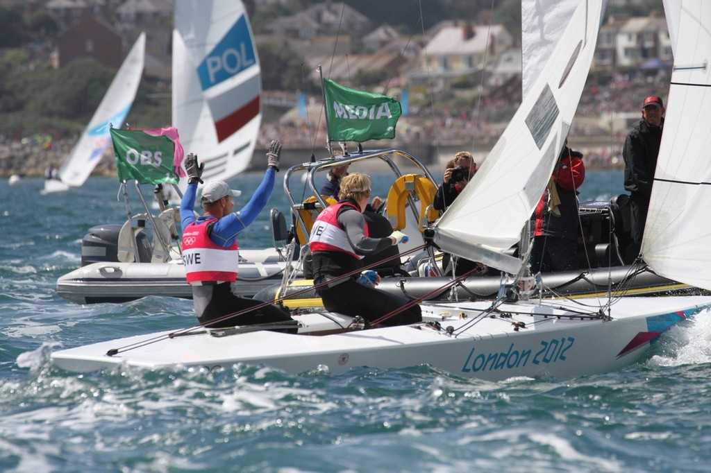  August 5, 2012 - Weymouth, England - Gold Medalist - Freddie Loof and Max Salminen (SWE) celebrate and line up for the Media and TV interview photo copyright Richard Gladwell www.photosport.co.nz taken at  and featuring the  class