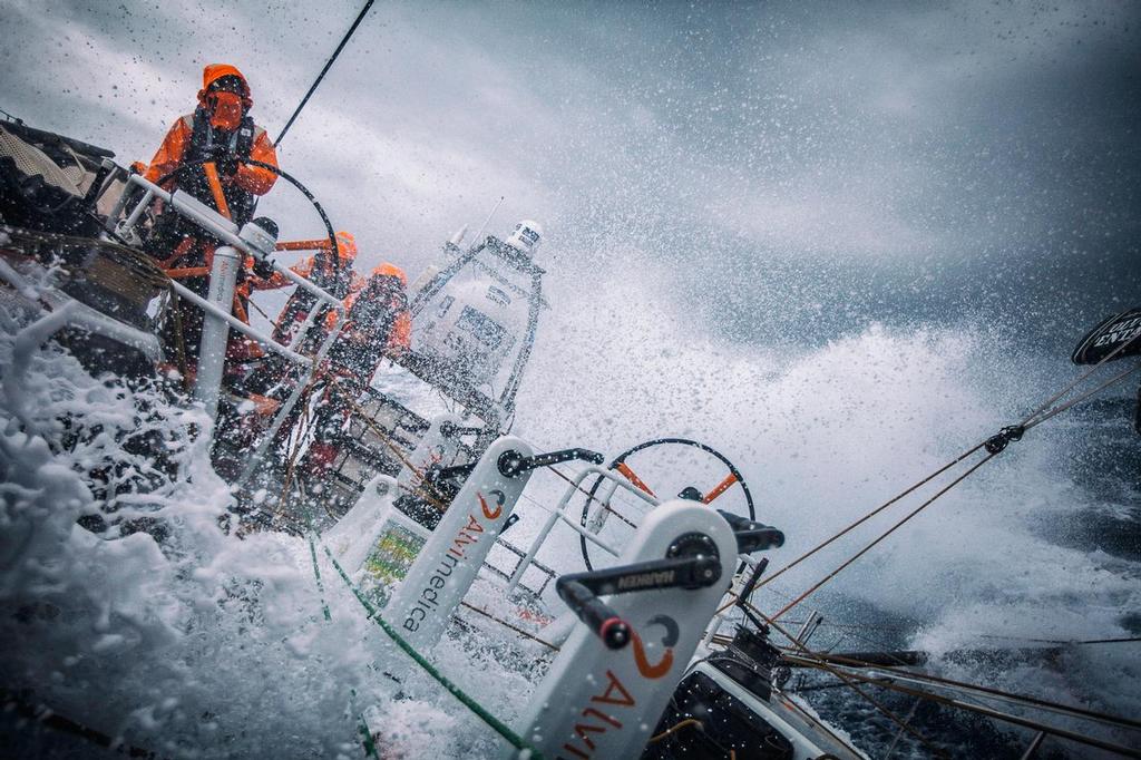 March 24, 2015. Leg 5 to Itajai onboard Team Alvimedica. Day 6. A late night gybe set off a wild day of true Southern Ocean sailing as the temps dropped and the wind and waves built with an approaching low pressure system and accompanying cold front. Stu Bannatyne driving in windy downwind conditions while pushing through an incoming Southern Ocean cold front. photo copyright  Amory Ross / Team Alvimedica taken at  and featuring the  class