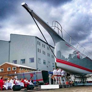 The new-look Wild Oats XI is unveiled at Woolwich Dock, on Sydney Harbour. The hull is now more buoyant in the forward sections, and the bowsprit is longer and more streamlined. Part of the 14-metre section of the bow that was cut from the yacht is in the background. - photo © Andrea Francolini / Audi http://www.afrancolini.com