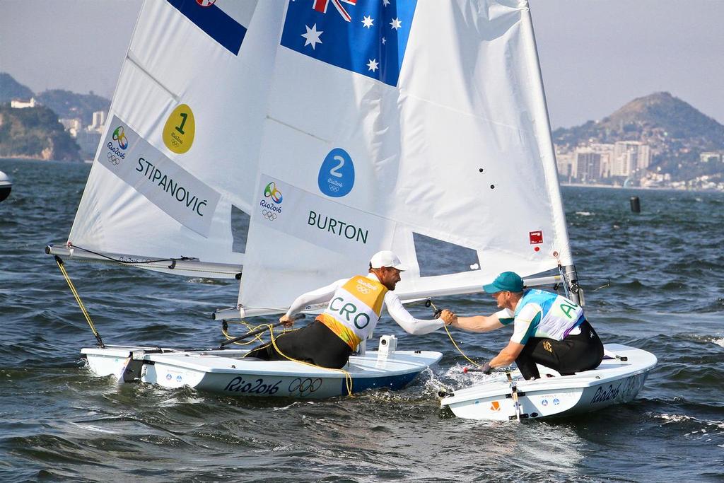 Silver medalist, Tonci Stianovic (CRO) congratulates the Gold medal winner, Tom Burton (AUS)  Mens Laser - 2016 Olympic Regatta photo copyright Richard Gladwell www.photosport.co.nz taken at  and featuring the  class