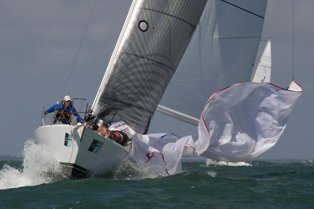 A J/105 goes for a fast spinnaker drop in monster conditions offshore during Day 2 of Sperry Charleston Race Week 2017. photo copyright Meredith Block/ Charleston Race Week http://www.charlestonraceweek.com/ taken at  and featuring the  class