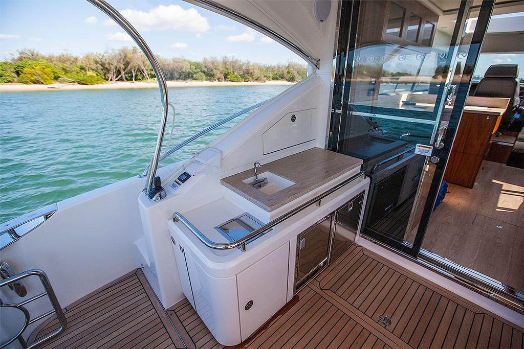 Aft joystick controller next to the fridge and icemaker under the prep bench. - Riviera 4800 Sport Yacht photo copyright  John Curnow taken at  and featuring the  class
