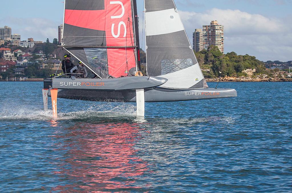 Charging along making 20 knots on Sydney Harbour. Easy! (from the chase boat) photo copyright  John Curnow taken at  and featuring the  class