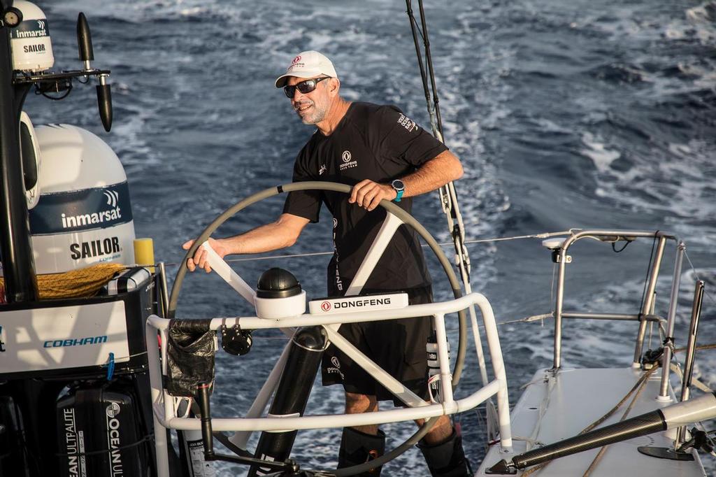 Volvo Ocean Race 2017/18 - Leg 01, Alicante to Lisbon. Stuart Bannatyne on the helm of Dongfeng enroute to the waypoint. 26 October, 2017 photo copyright  Rich Edwards / Volvo Ocean Race taken at  and featuring the  class