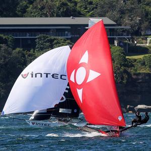 Race 1 – Noakesailing is challenged by Vintec for second place on the spinnaker run down the middle of Sydney Harbour – 18ft Skiffs NSW Championship photo copyright  Frank Quealey / Australian 18 Footers League taken at  and featuring the  class