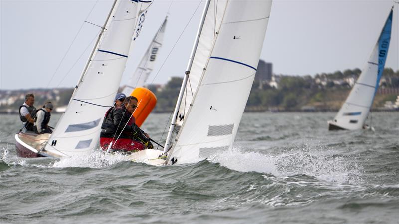 The Dogs 5, sail number 156 (Mark Jewell & Paul Farrall) rounding the windward mark with Sea Pantom, sail number 33 (Peter Thompson & Clara Hunter) in close vicinty in race 6 on Sunday during the Sandhopper Nationals at Thorpe Bay photo copyright David Maynard / www.alleycatphotographer.com taken at Thorpe Bay Yacht Club and featuring the Sandhopper class