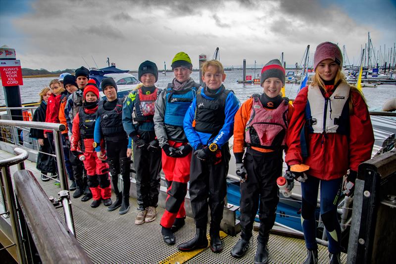 Junior sailors at Royal Lymington Yacht Club line up before taking part in the Peter Andreae Trophy 2021 photo copyright Paul French taken at Royal Lymington Yacht Club and featuring the Scow class