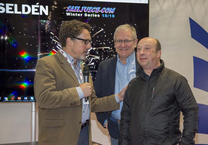 Andy Rice talks with Steve Norbury of Seldén as they are announced as the title sponsor of the SailJuice Winter Series 2018/19 photo copyright Tim Olin / www.olinphoto.co.uk taken at RYA Dinghy Show and featuring the  class