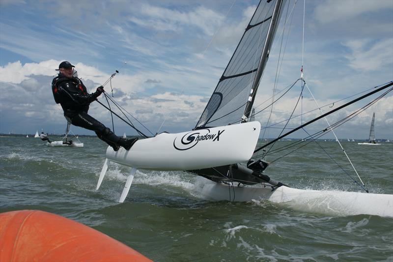 Paul Tanner at the finish line during the Shadow nationals at Gurnard photo copyright Nick Hart taken at Gurnard Sailing Club and featuring the Shadow class