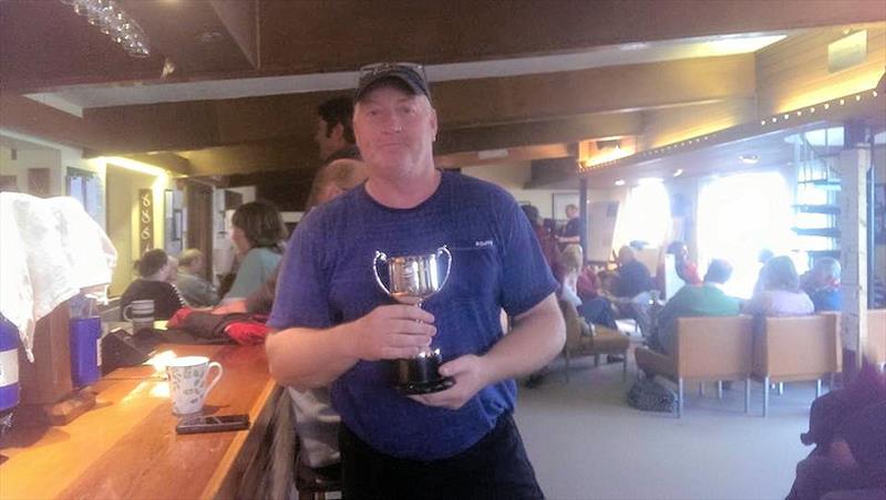 2015 Shadow National Champion Paul Tanner complete with celebratory cup of tea photo copyright Pat Moore taken at Eastbourne Sovereign Sailing Club and featuring the Shadow class