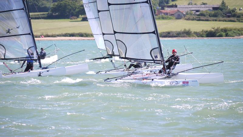 Close racing in the Shadows at Cowes Dinghy Week photo copyright Liz Harrison taken at Gurnard Sailing Club and featuring the Shadow class