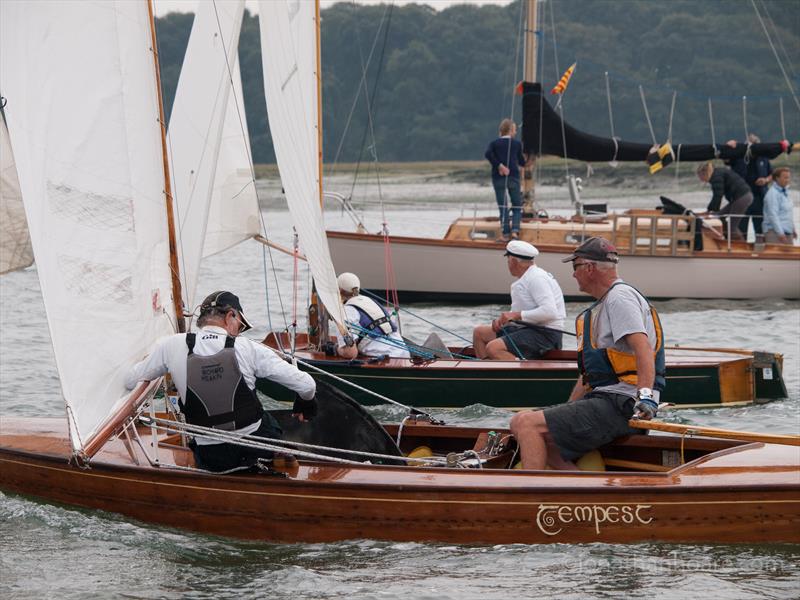 Sharpies - ‘Garganey' & ‘Tempest' race neck and neck, 1949 build just ahead of 1950 build during the Bosham Classic Boat Revival 2014 photo copyright Jonathan Hoare / www.jonathanhoare.com taken at Bosham Sailing Club and featuring the Sharpie class