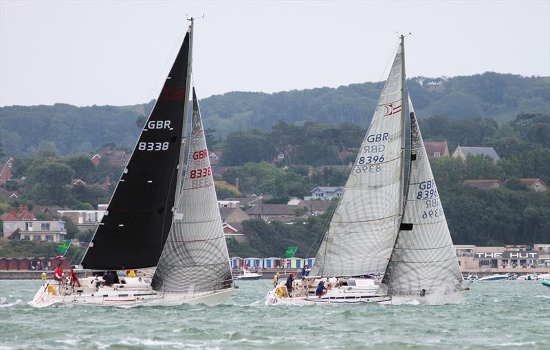 Sigma 38s pass Hurst Castle in the 2019 Rolex Fastnet Race photo copyright Mark Jardine taken at Royal Ocean Racing Club and featuring the Sigma 38 class