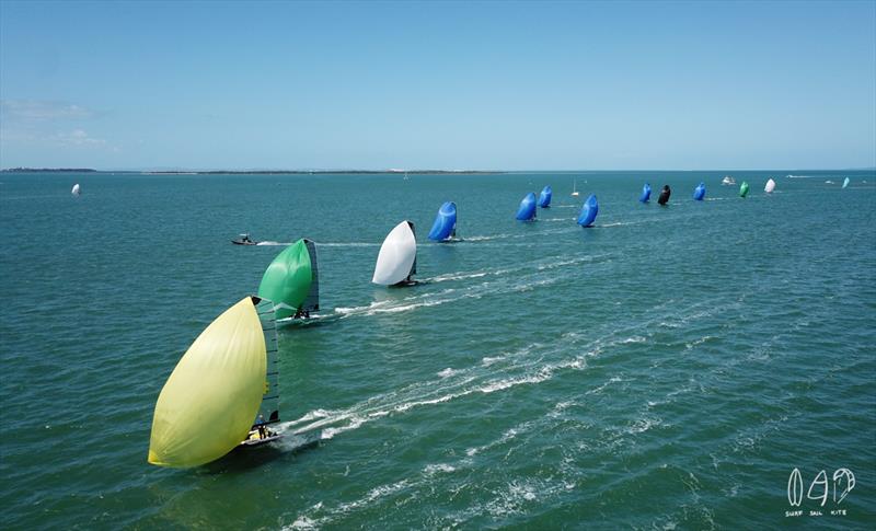 A colourful site as the 16's fly downwind - photo © Mitchell Pearson / SurfSailKite