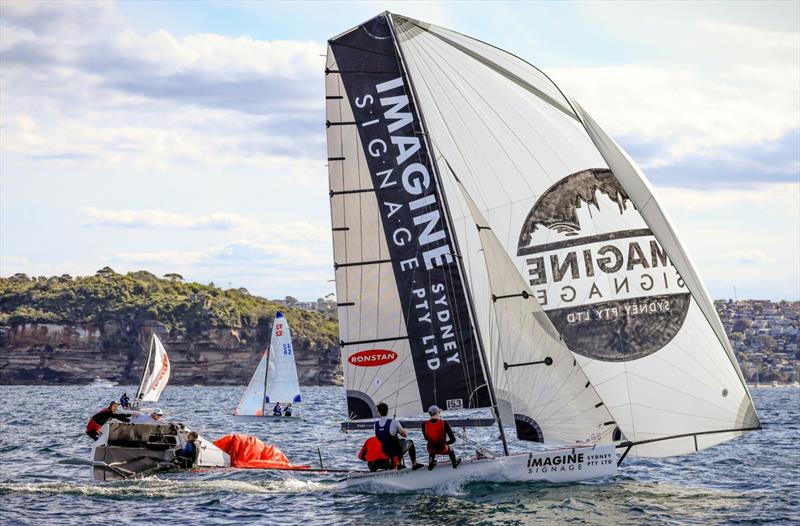 Imagine Signage sails past photo copyright Sail Media taken at Manly 16ft Skiff Sailing Club and featuring the 16ft Skiff class