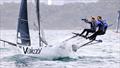 Crew works hard on a spinnaker run © SailMedia